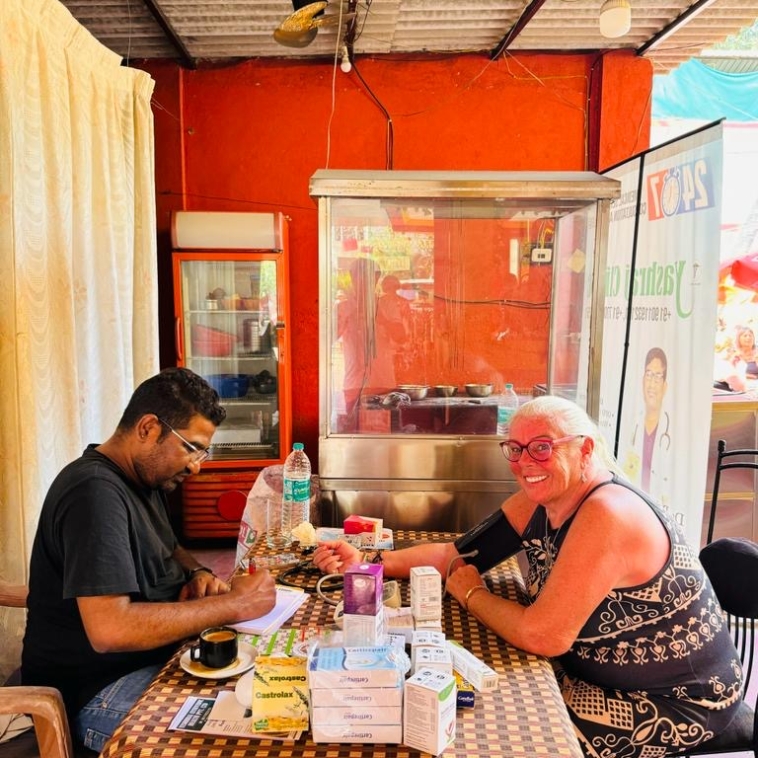 Doctor consultation at Yashraj Clinic — vitals and BP check with a patient