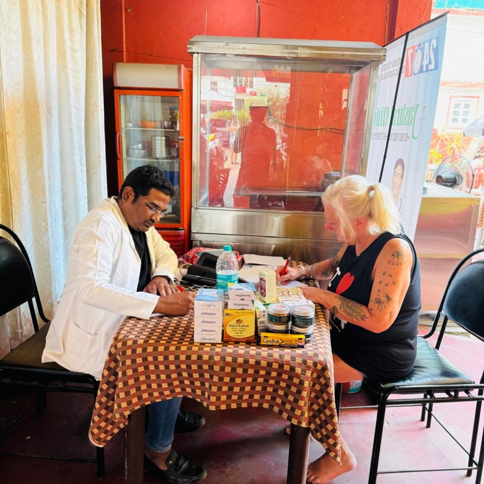 Dr. Raju Bhusanar reviewing consultation notes with a patient at Yashraj Clinic